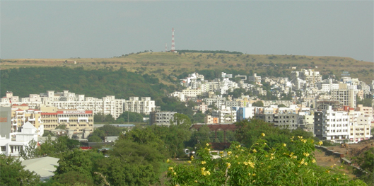 High hills, blue skies merging all with greens depicts modern Bavdhan.
